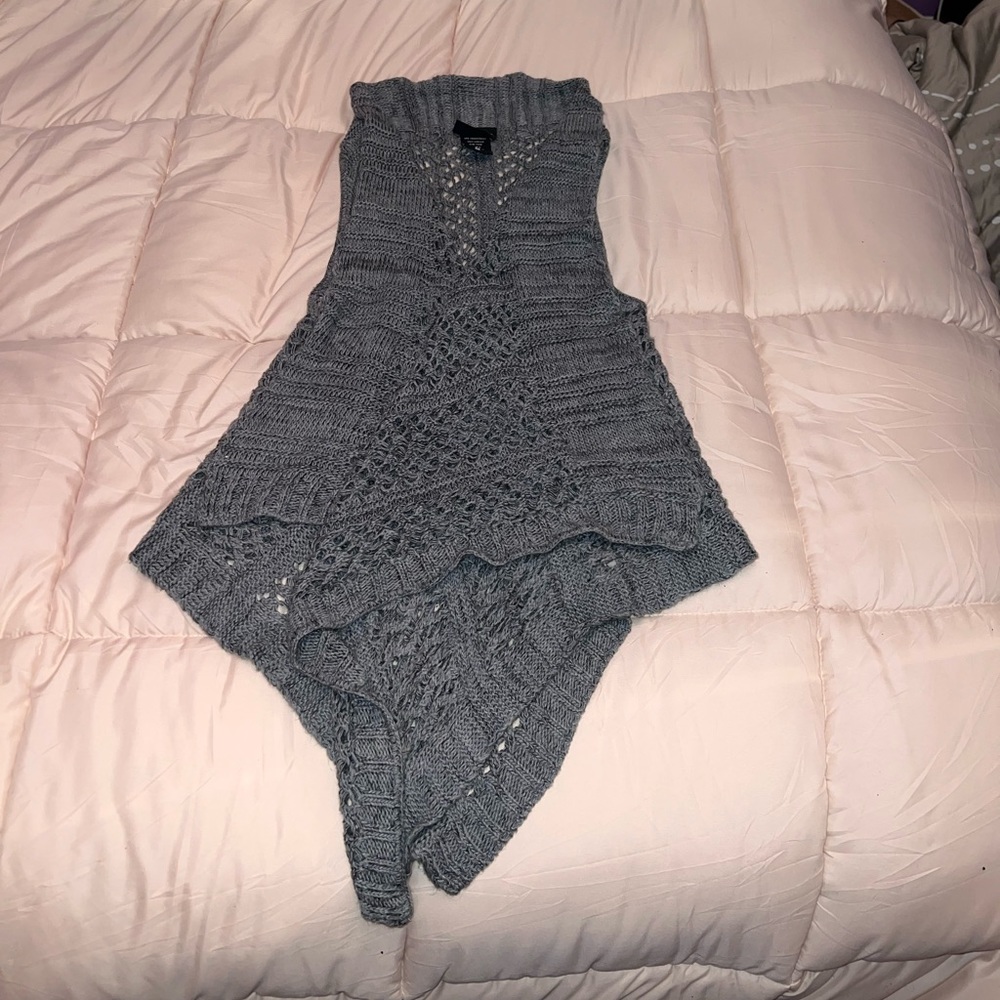 Knitted sweater vest.
